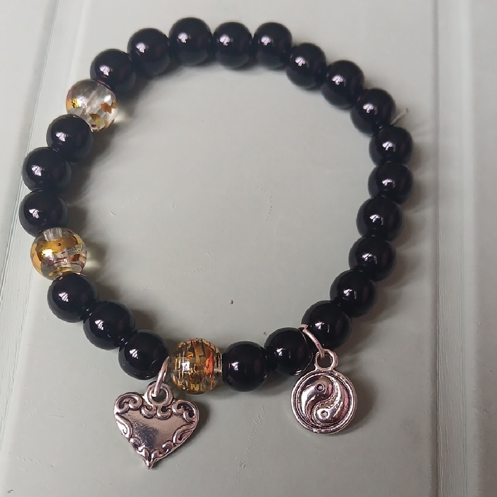 Black Beaded Bracelet with Silver Charms